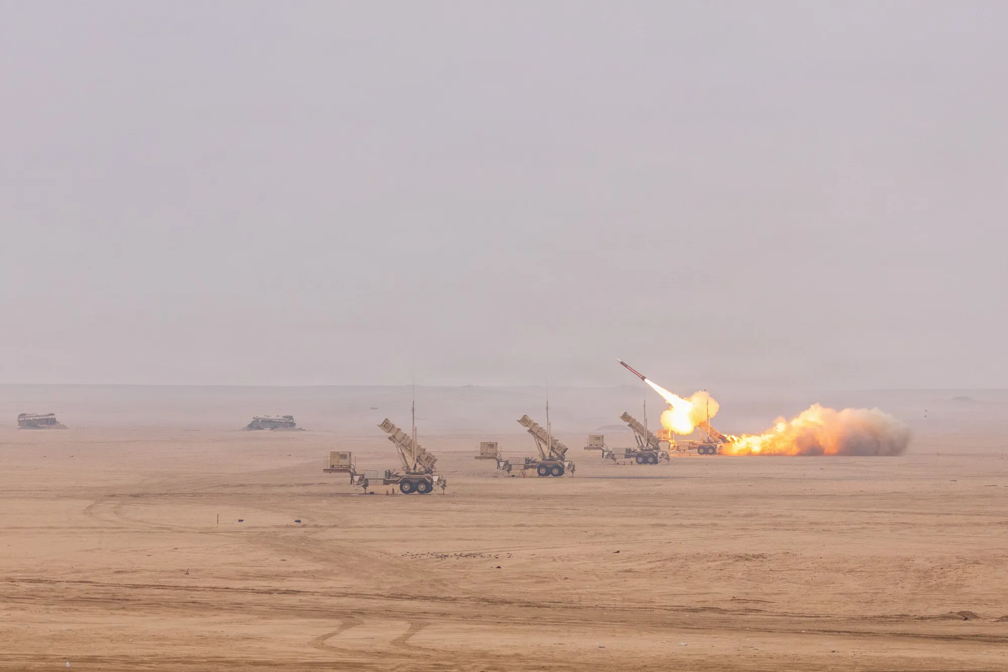 A Patriot battery firing a missile across a desert range during the Sky Shield exercise