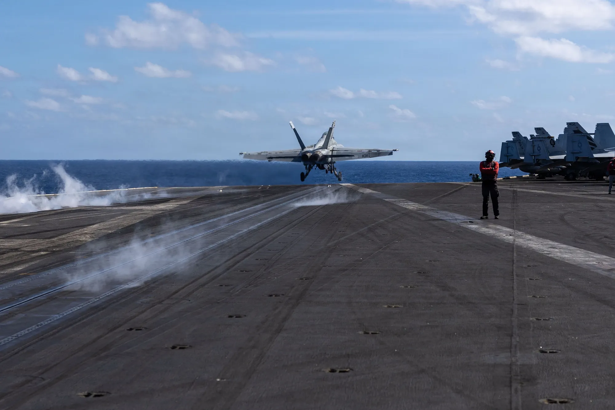 An F/A-18F Super Hornet launching from the flight deck of USS Abraham Lincoln